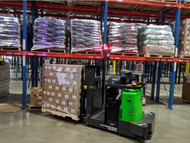 Automated pallet truck with full pallet load.